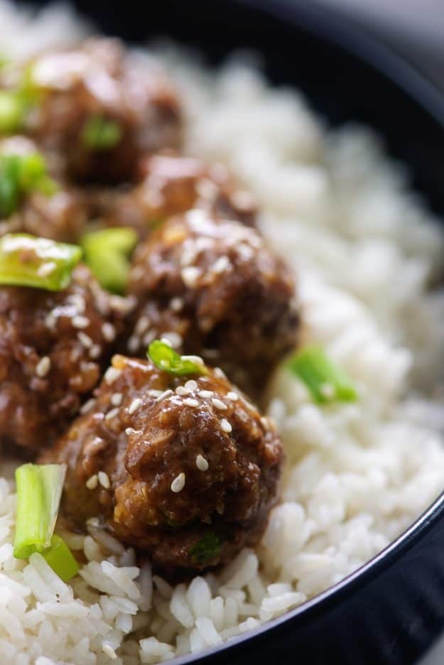 teriyaki meatballs in bowl of white rice.