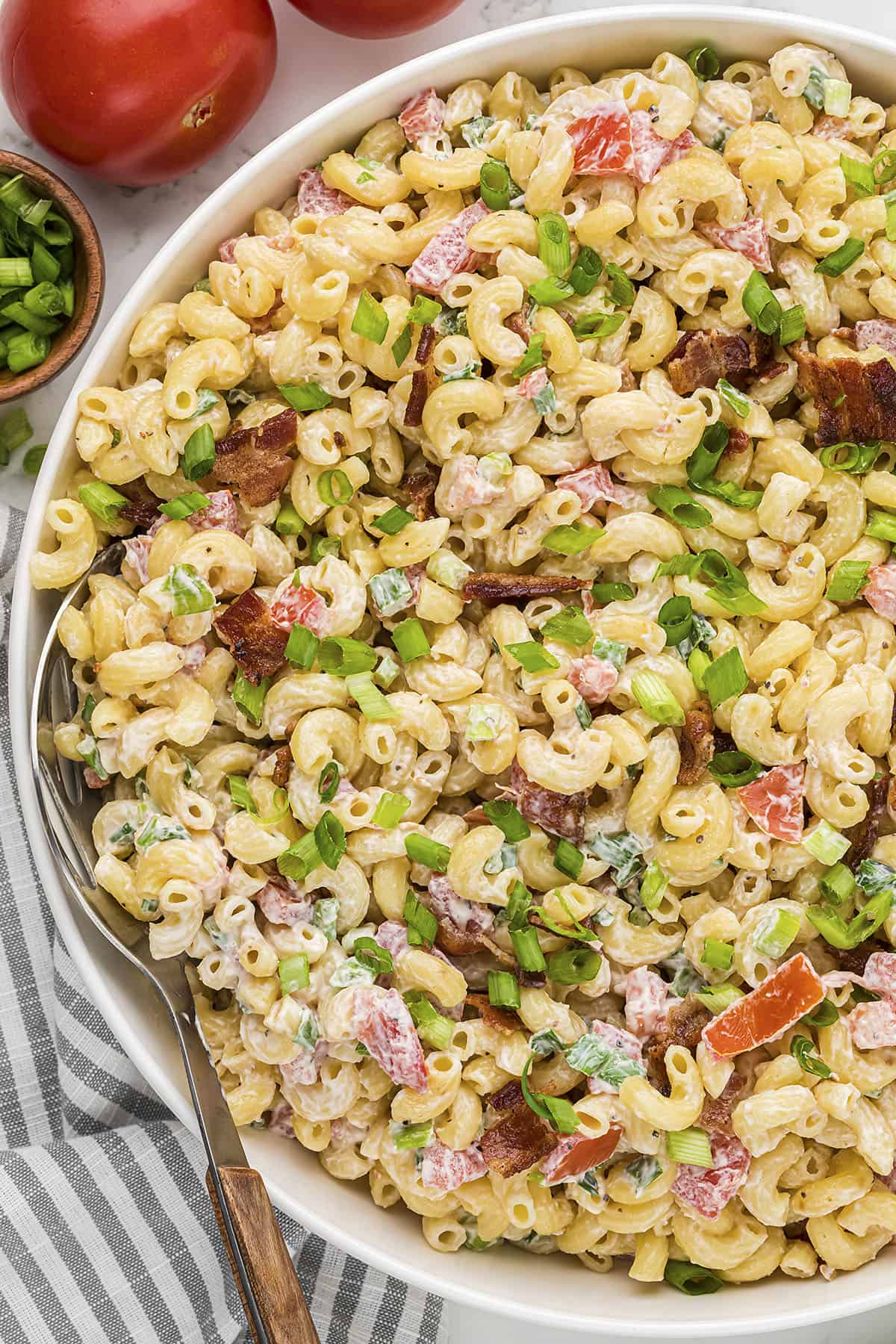 My whole family loves this BLT pasta salad recipe. It's packed with bacon, tomatoes, and green onions.