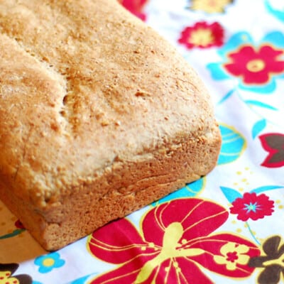 A close up of honey wheat bread on a napkin.