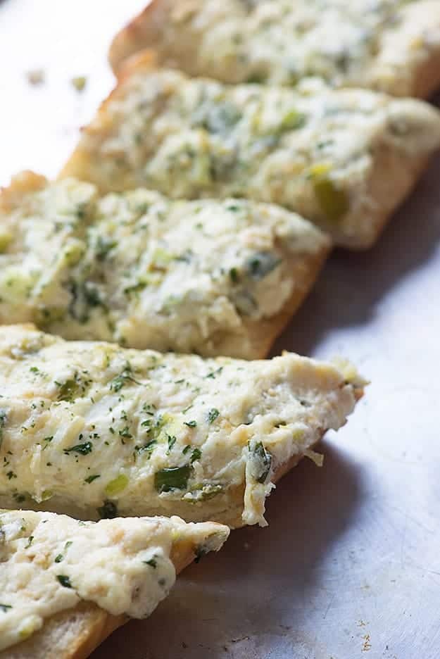 This garlic bread recipe will teach you how to make the best homemade garlic bread ever! It's creamy, cheesy, and full of flavor.