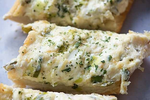 This garlic bread recipe will teach you how to make the best homemade garlic bread ever! It's creamy, cheesy, and full of flavor.