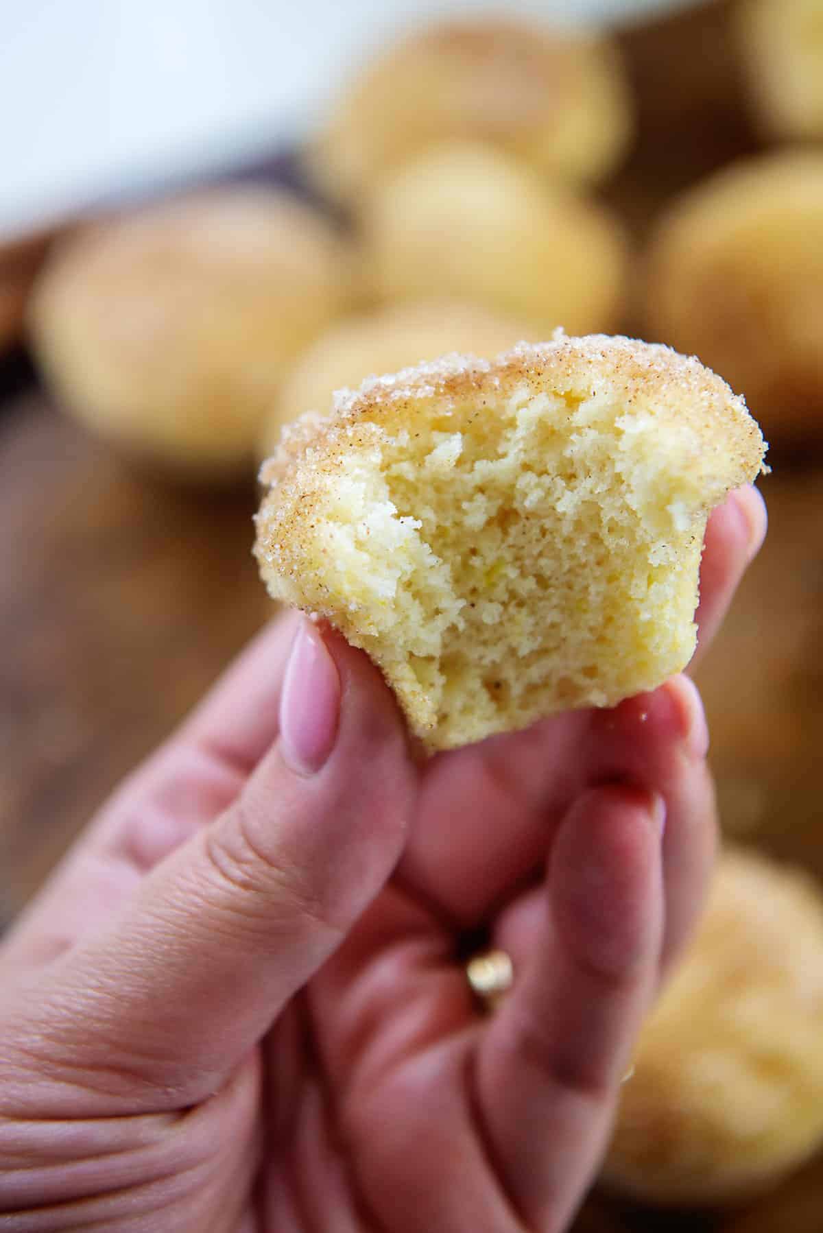 donut muffin in woman's hand.