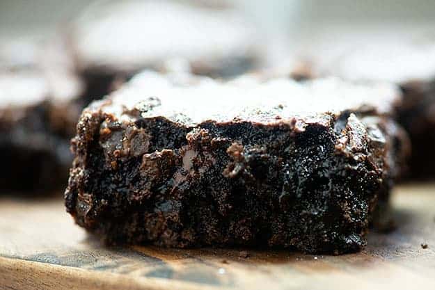 fudgy brownies on a wooden cutting board