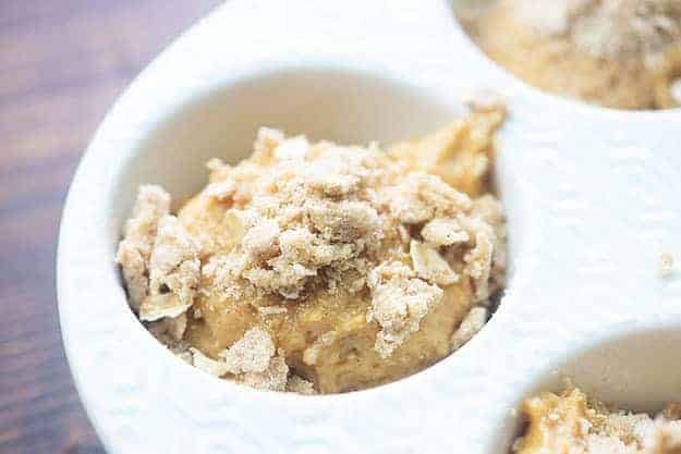 uncooked pumpkin muffins topped with streusel