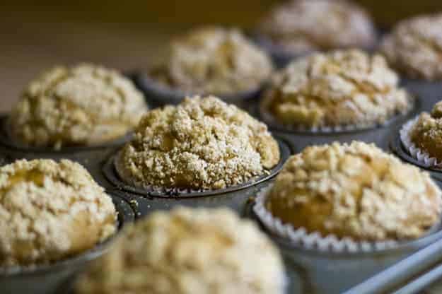 Pumpkin muffins cooked in a muffin pan.