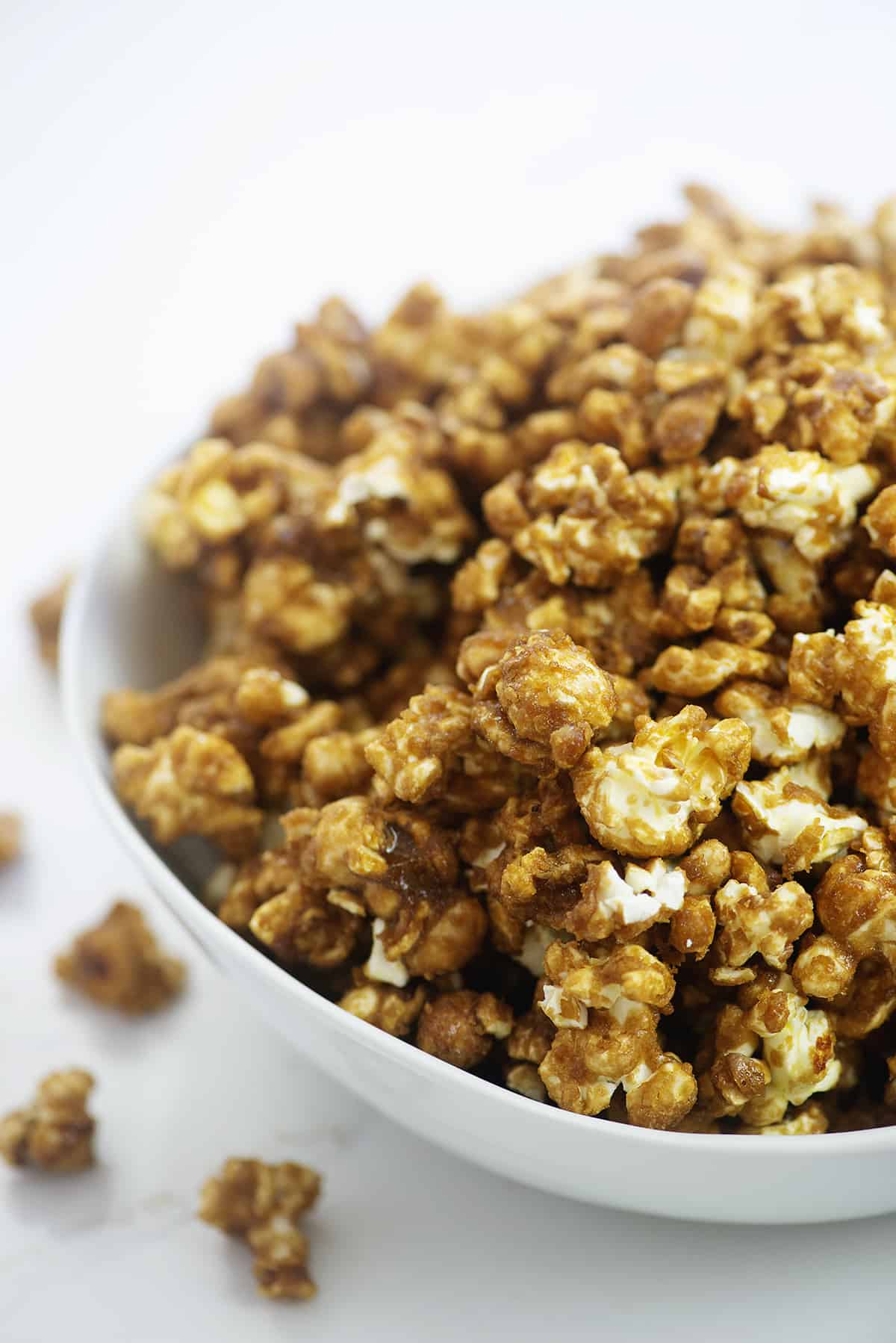 Caramel corn recipe in white bowl.