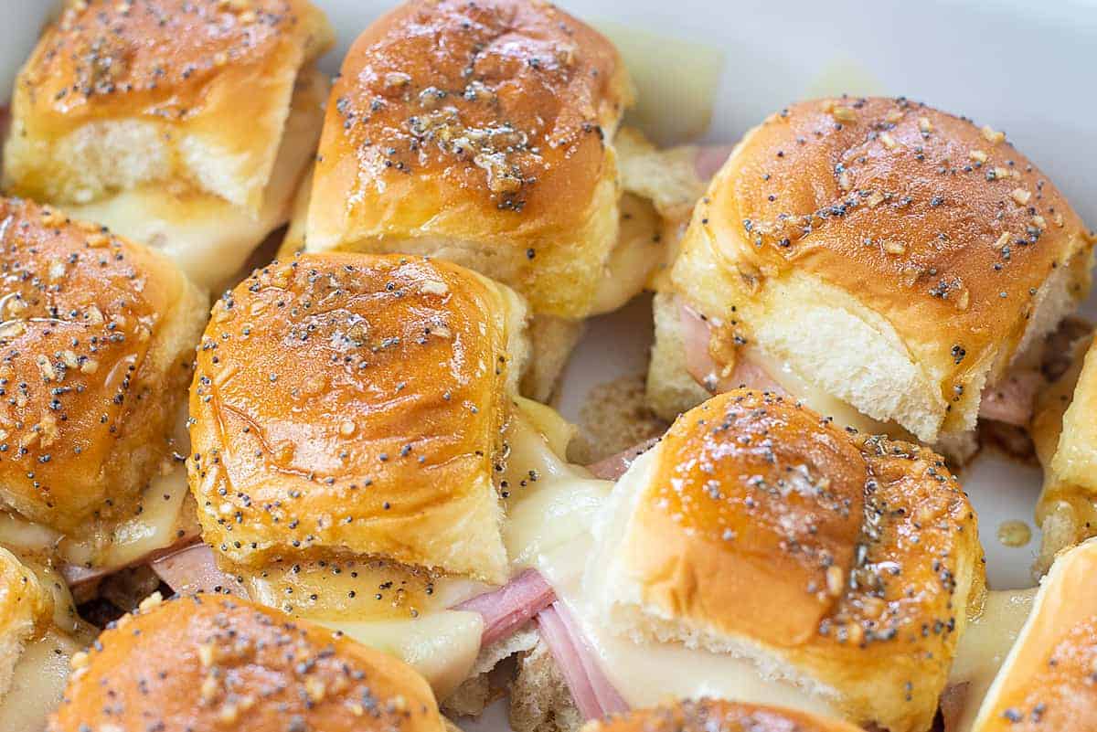 Hawaiian roll ham and cheese sliders in baking dish.