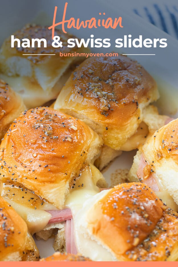 Hawaiian rolls filled with ham and cheese in baking dish.