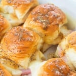 Hawaiian ham and cheese sliders in white baking dish.