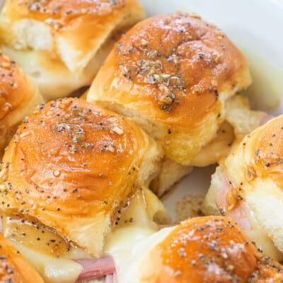 Hawaiian ham and cheese sliders in white baking dish.