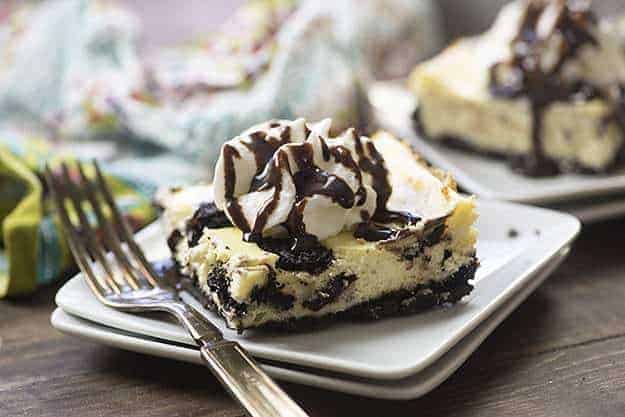 This Oreo cheesecake recipe has just a handful of ingredients! We love the Oreo cookie crust hiding under the creamy cheesecake!