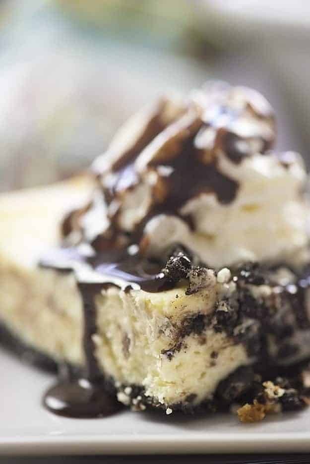 This Oreo cheesecake recipe has just a handful of ingredients! We love the Oreo cookie crust hiding under the creamy cheesecake!