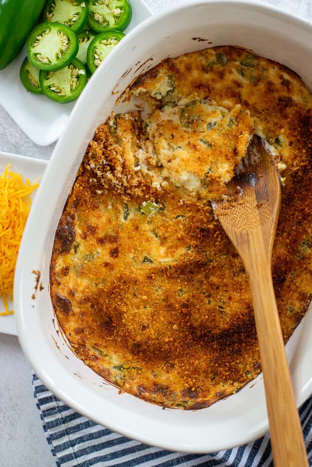 baked jalapeno cheese dip in white dish.