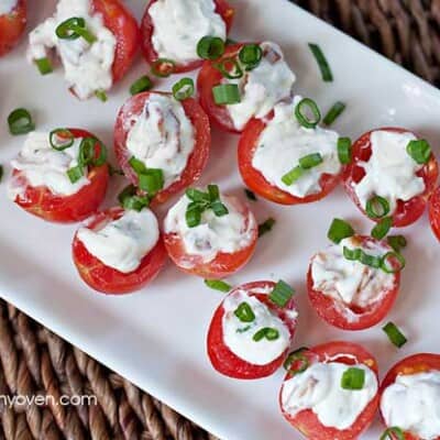 An appetizer tray full of BLT tomatoes