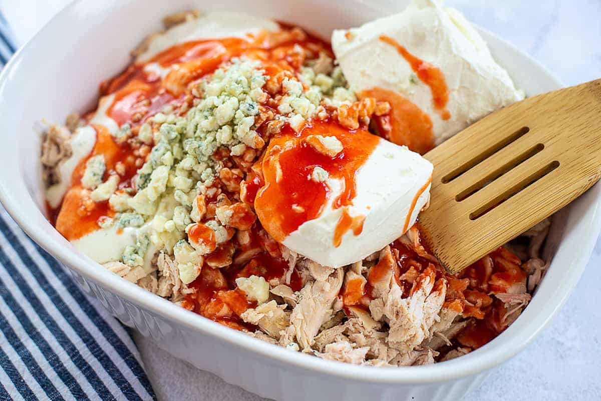 ingredients for easy buffalo chicken dip in bowl.