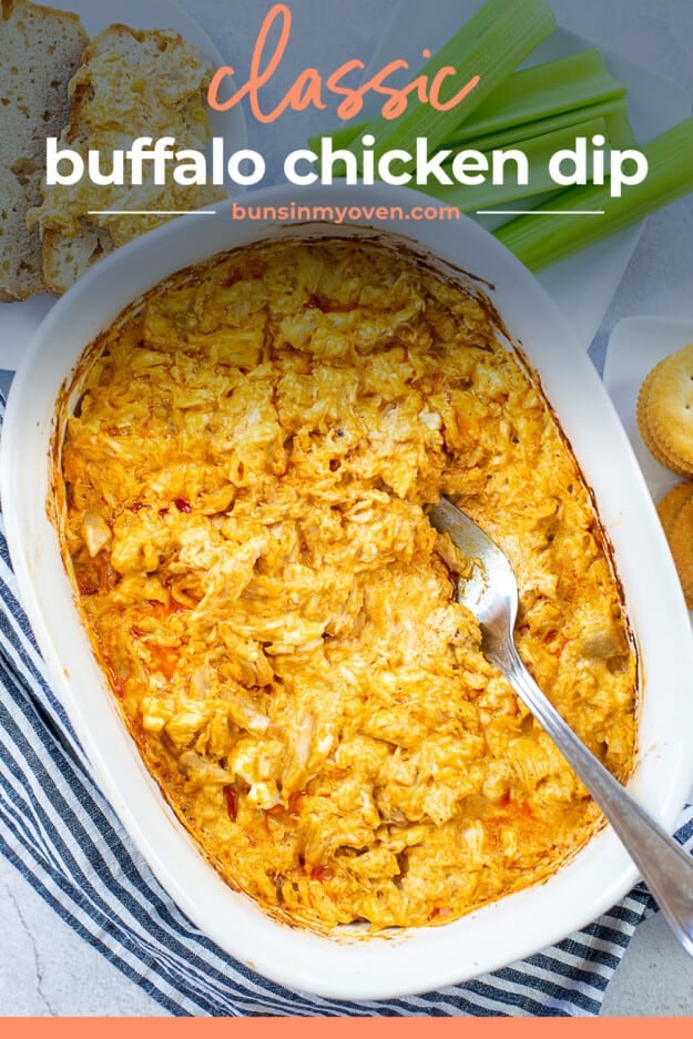 cheesy chicken dip in white baking dish.