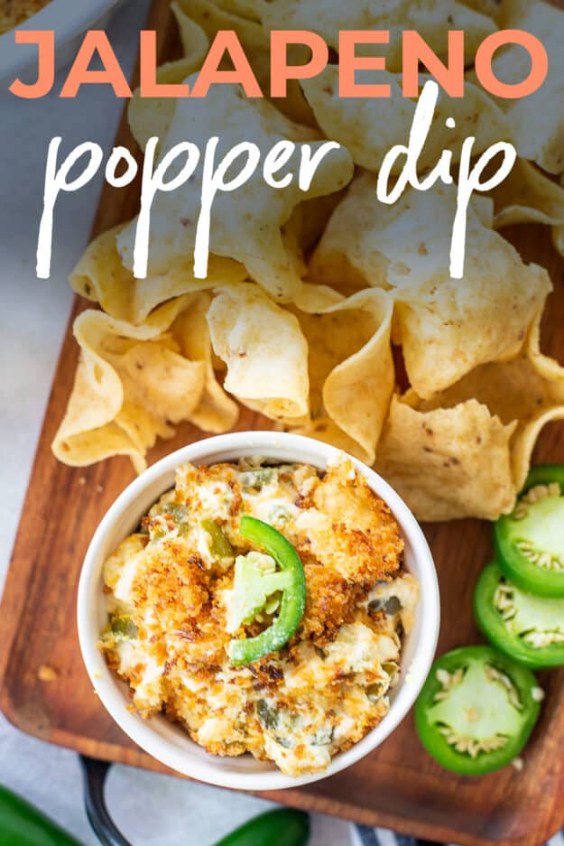 jalapeno popper dip next to chips with text for Pinterest.
