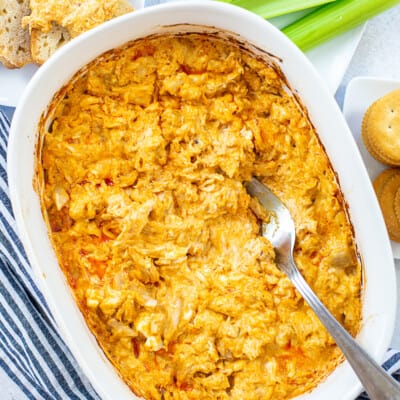 baked buffalo chicken dip in baking dish.