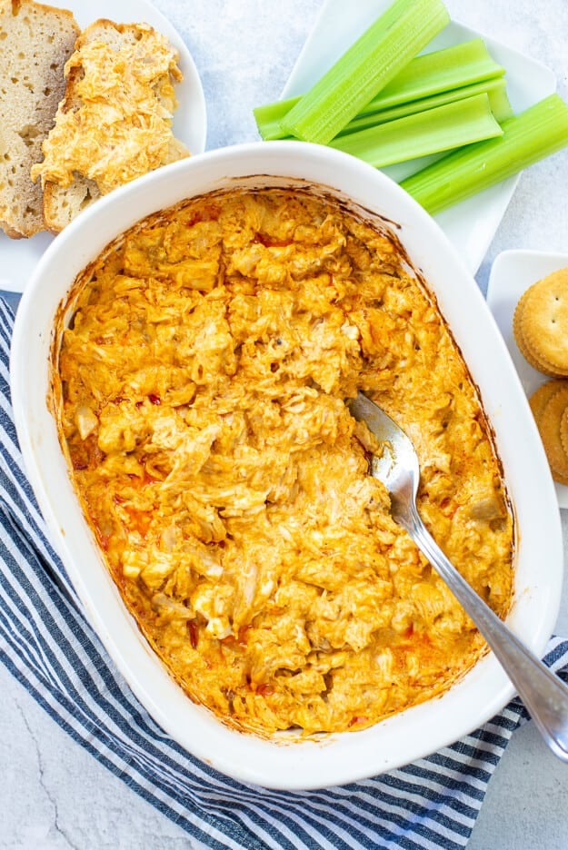 baked buffalo chicken dip in baking dish.