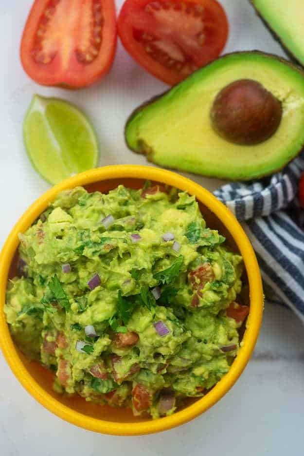 best guacamole recipe in yellow bowl