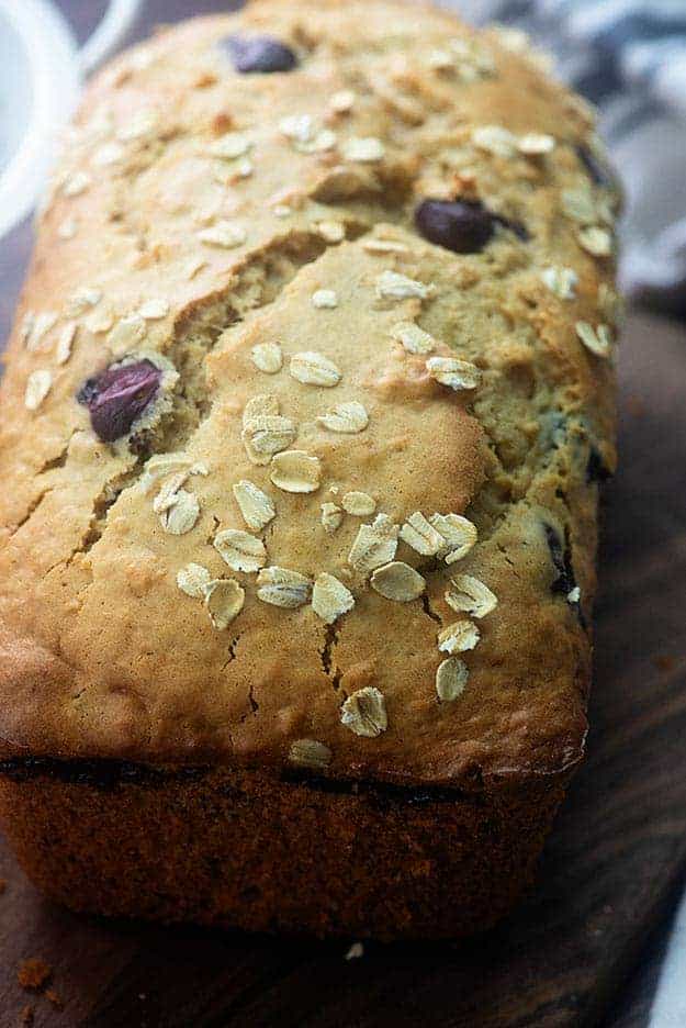 Close up of oatmeal bread on a cutting board.