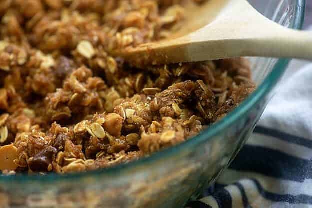 granola bar mixture in glass bowl.