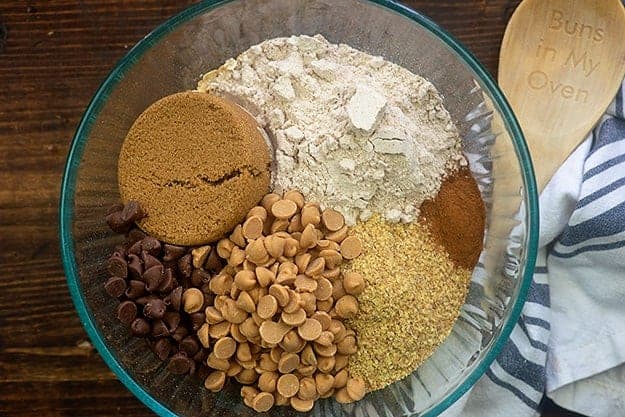 ingredients for granola bars in glass bowl.