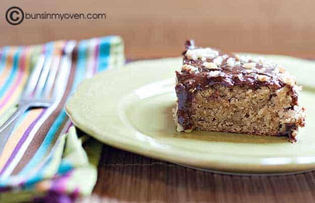 cake with chocolate frosting on green plate with striped napkin