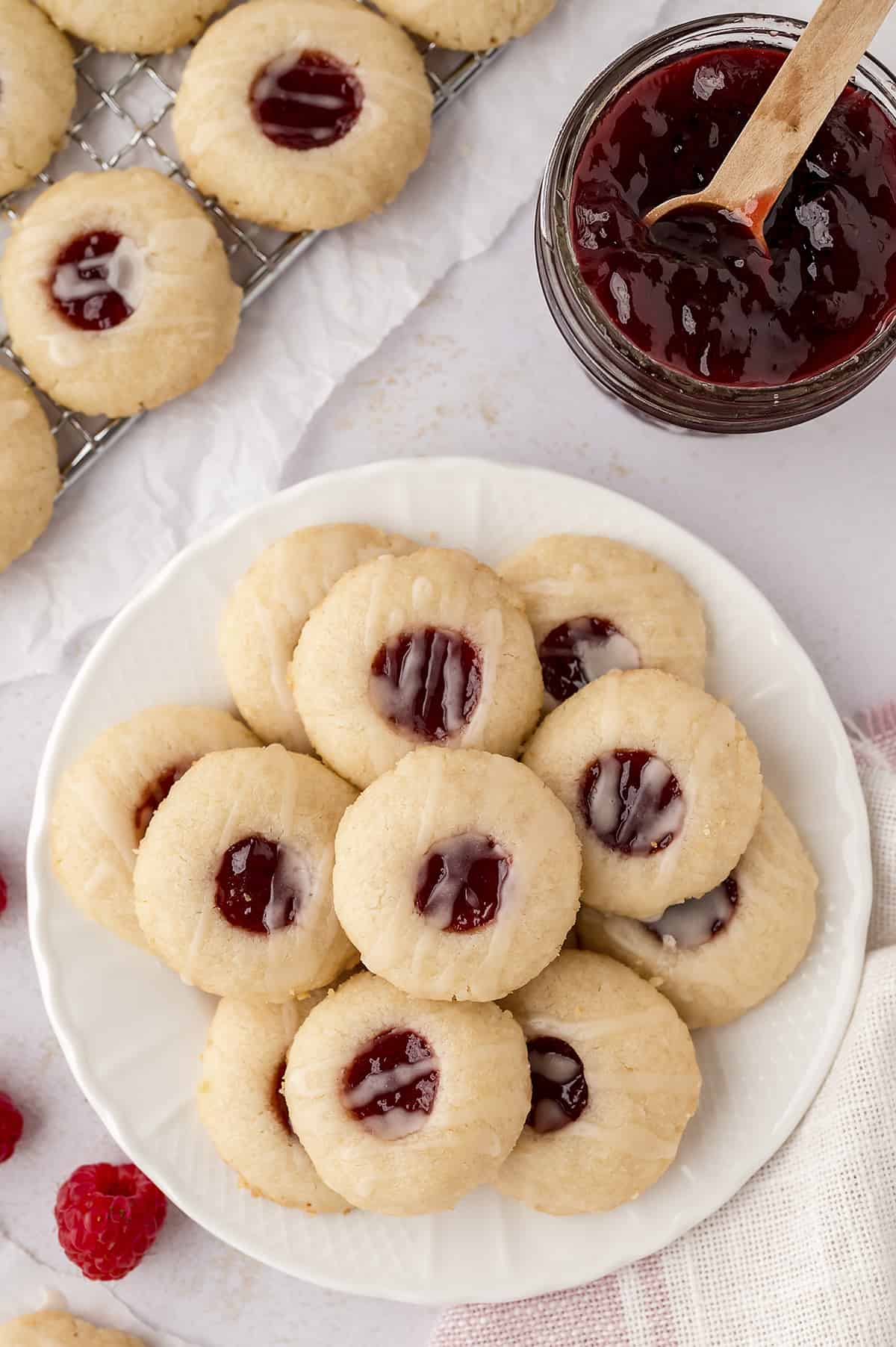 Thumbprint cookies on white plate.