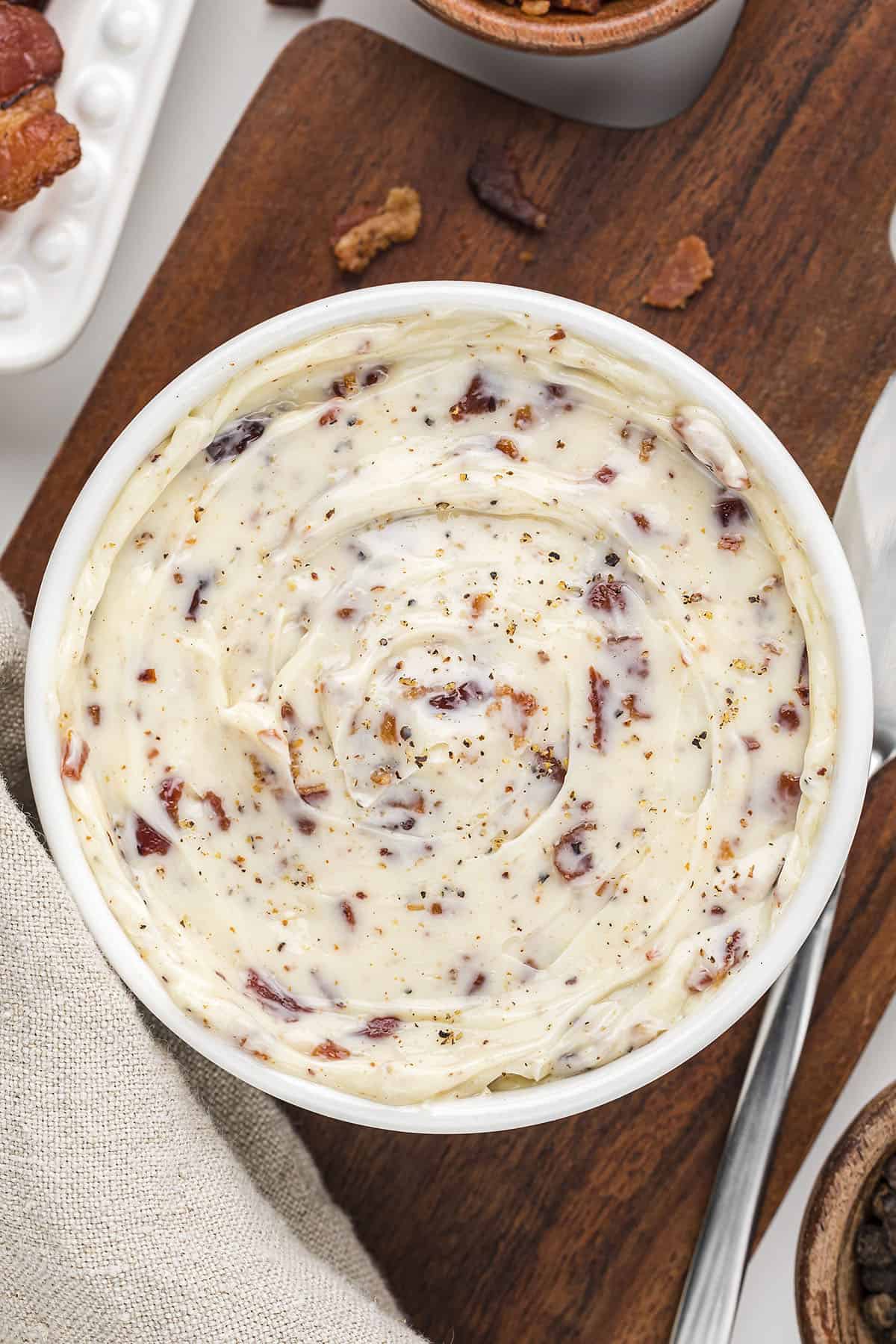 Bacon butter in small white serving dish.