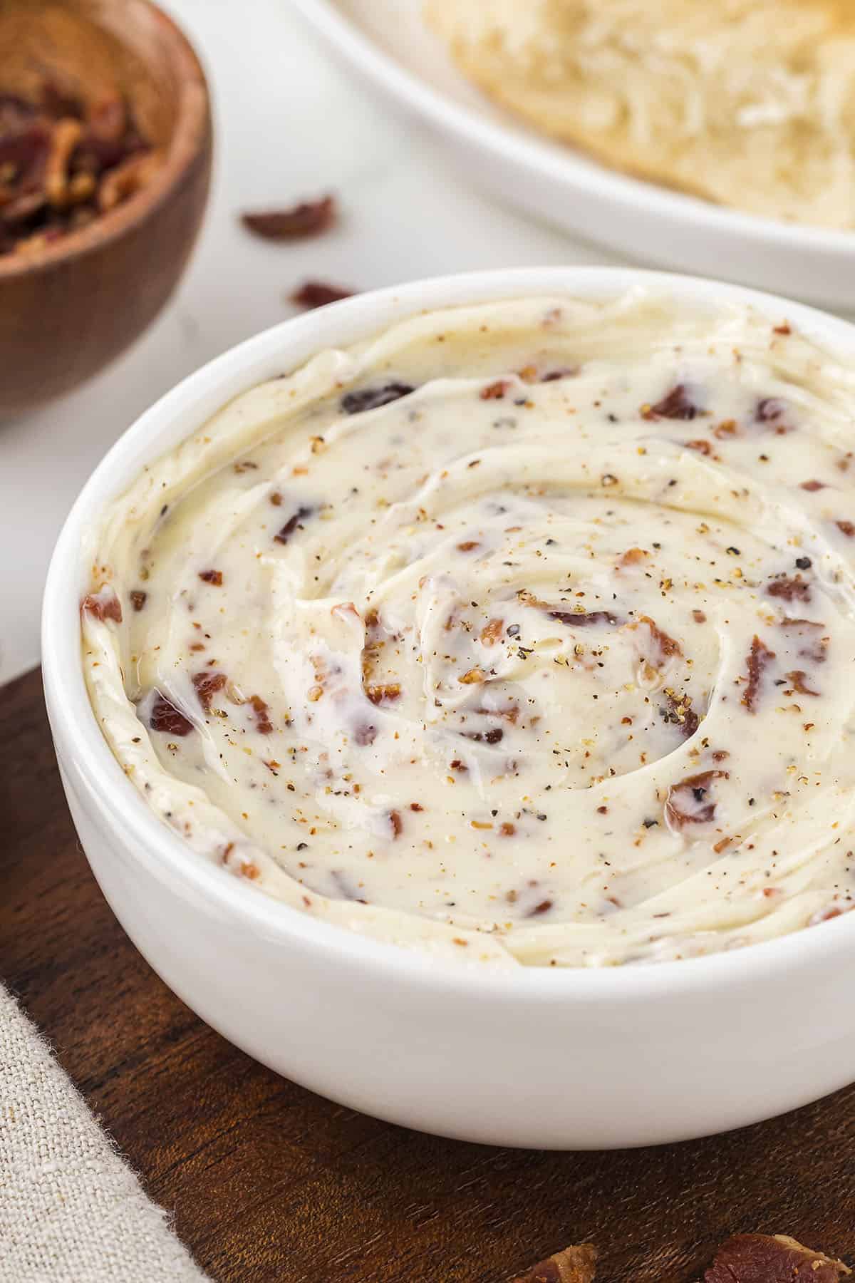 Bacon butter in small white bowl.