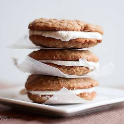 Three stacked sandwich cookies separated by napkins