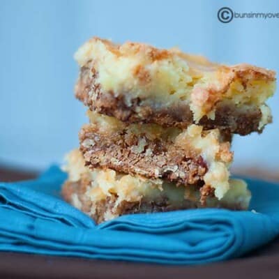 The stacked butter pecan squares on a cloth napkin