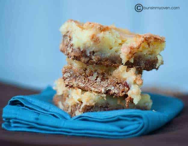 The stacked butter pecan squares on a cloth napkin