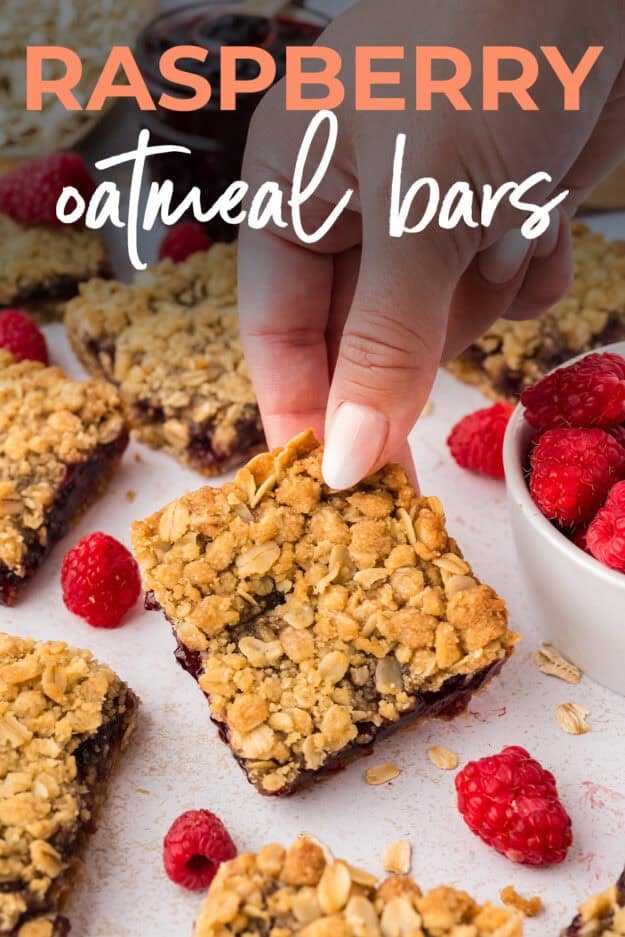 Hand grabbing an oatmeal bar.
