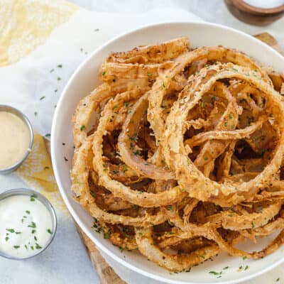 onion strings in white bowl.