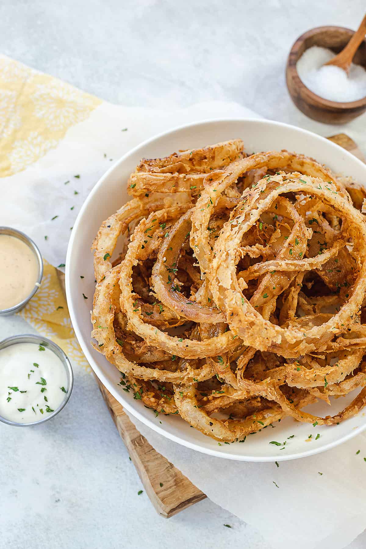 onion strings in white bowl.