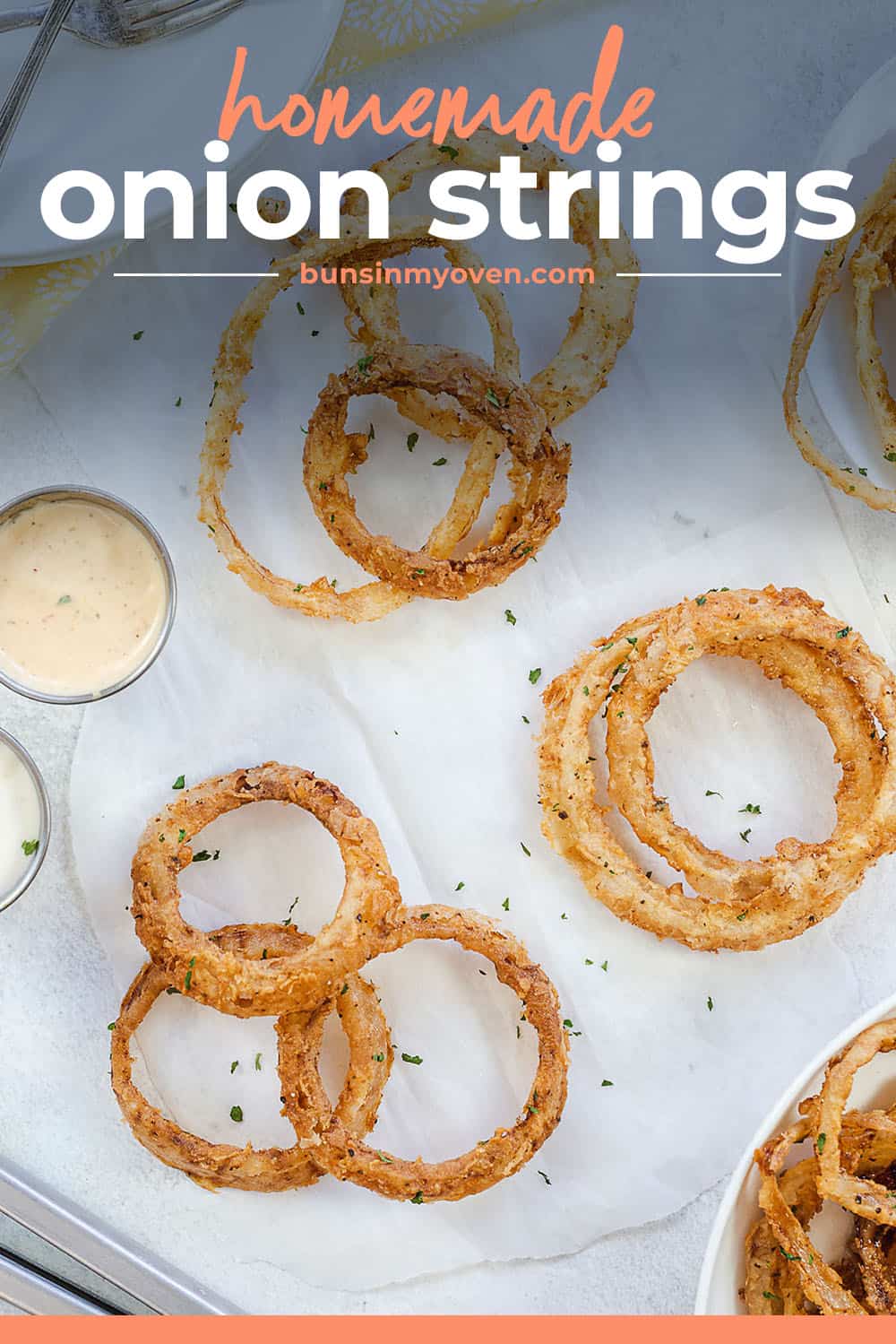 homemade onion strings on parchment paper.