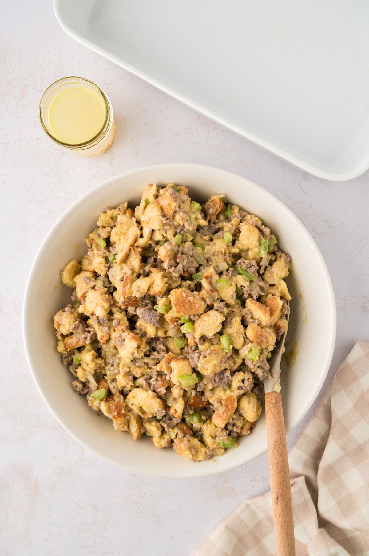 Sausage stuffing ingredinets in mixing bowl.
