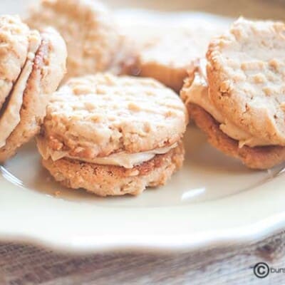 Peanut butter sandwich cookies on a plate.