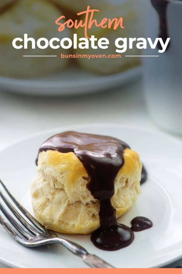 southern style chocolate gravy poured over biscuit on white plate.