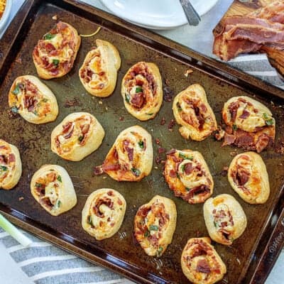 bacon pinwheels on sheet pan.