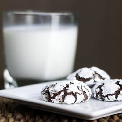 Three chocolate espresso snowcaps on a square white plates