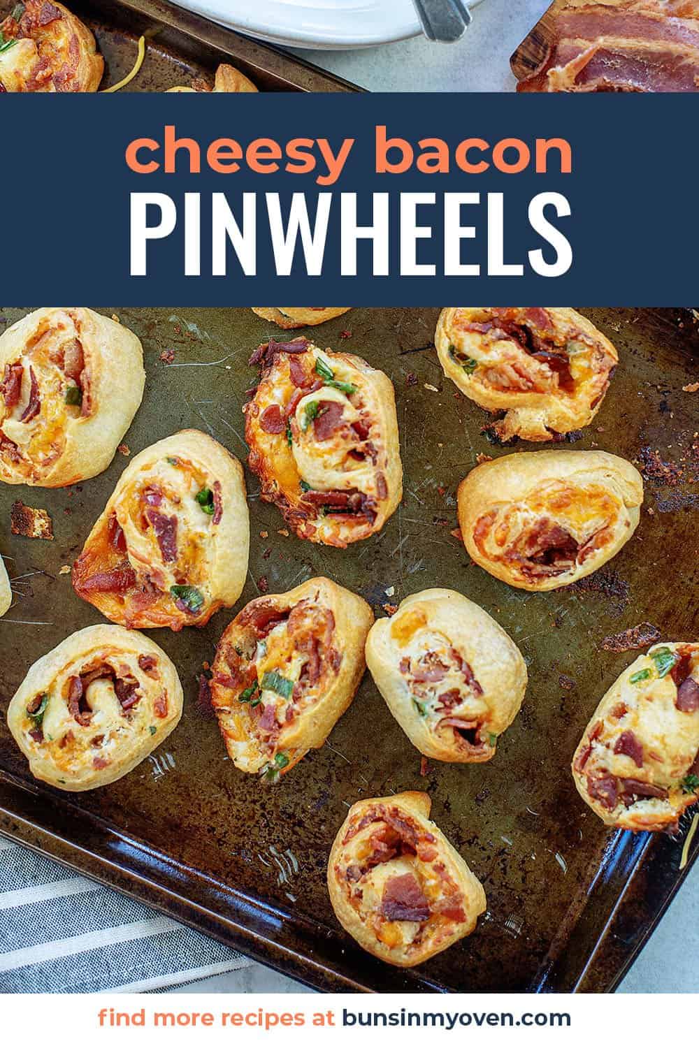 cheddar bacon pinwheels on baking pan.