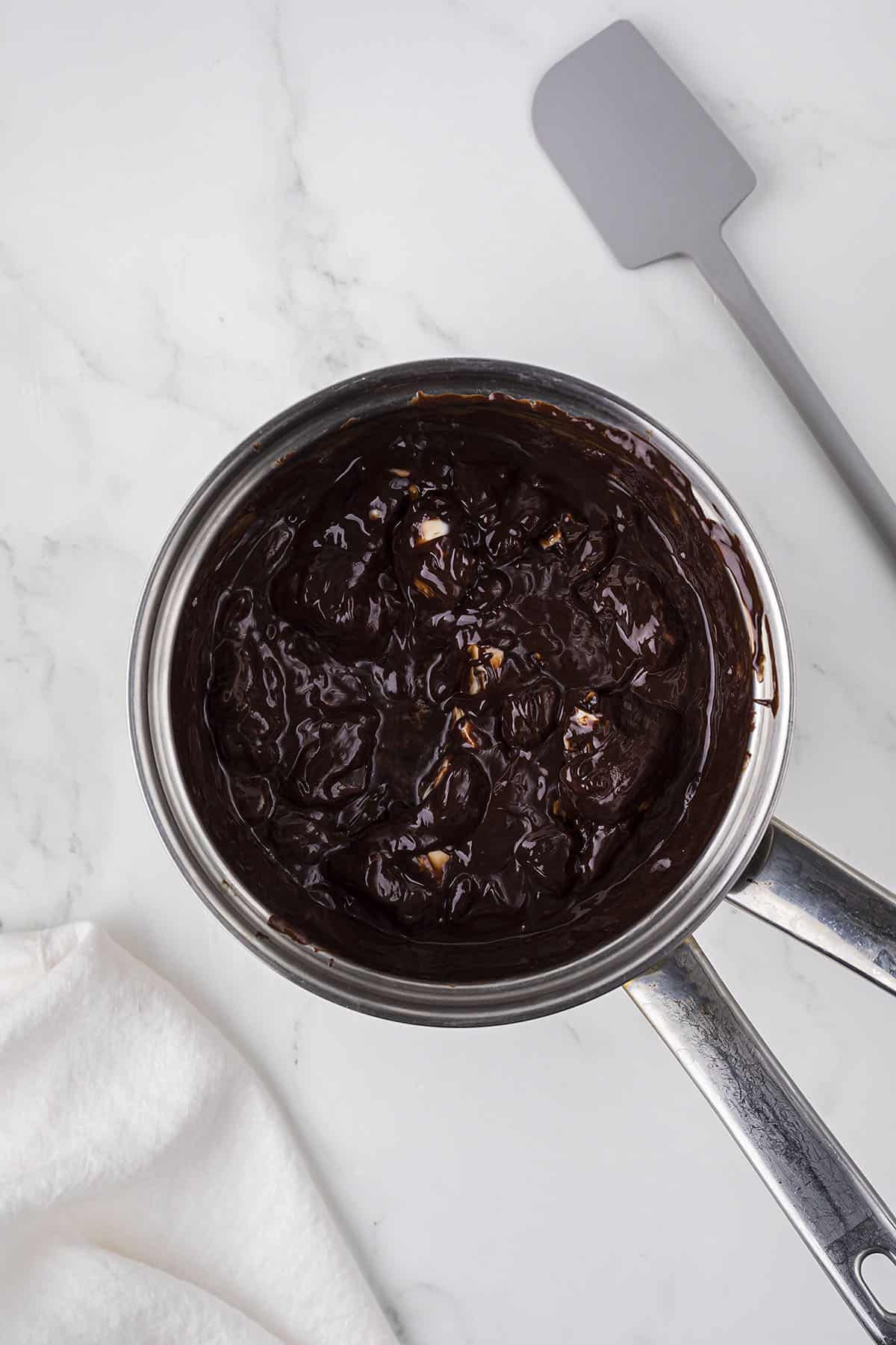 Chocolate and butter being melted in double boiler.