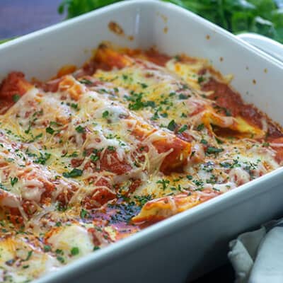 baked manicotti in white baking dish