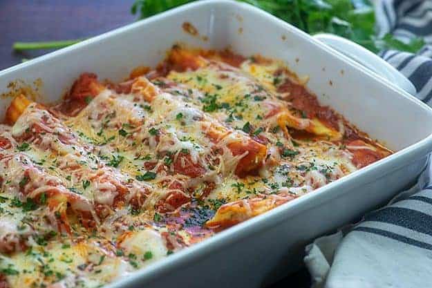 baked manicotti in white baking dish