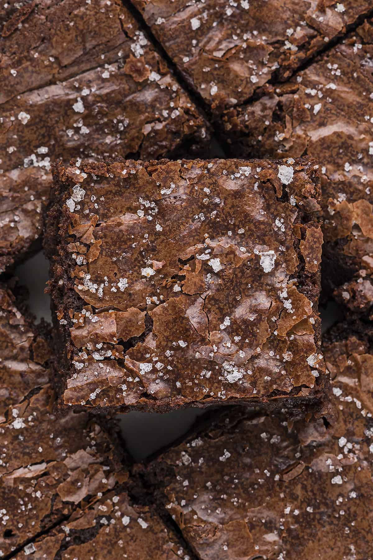 Sliced brownies stacked on top of each other.