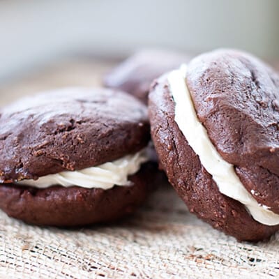 Two chocolate whoppie pies on a table