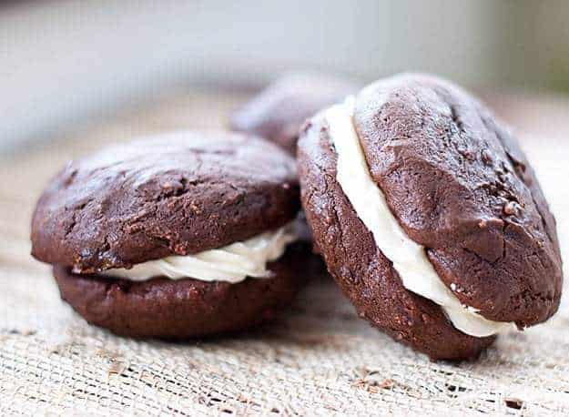 Two chocolate whoppie pies on a table